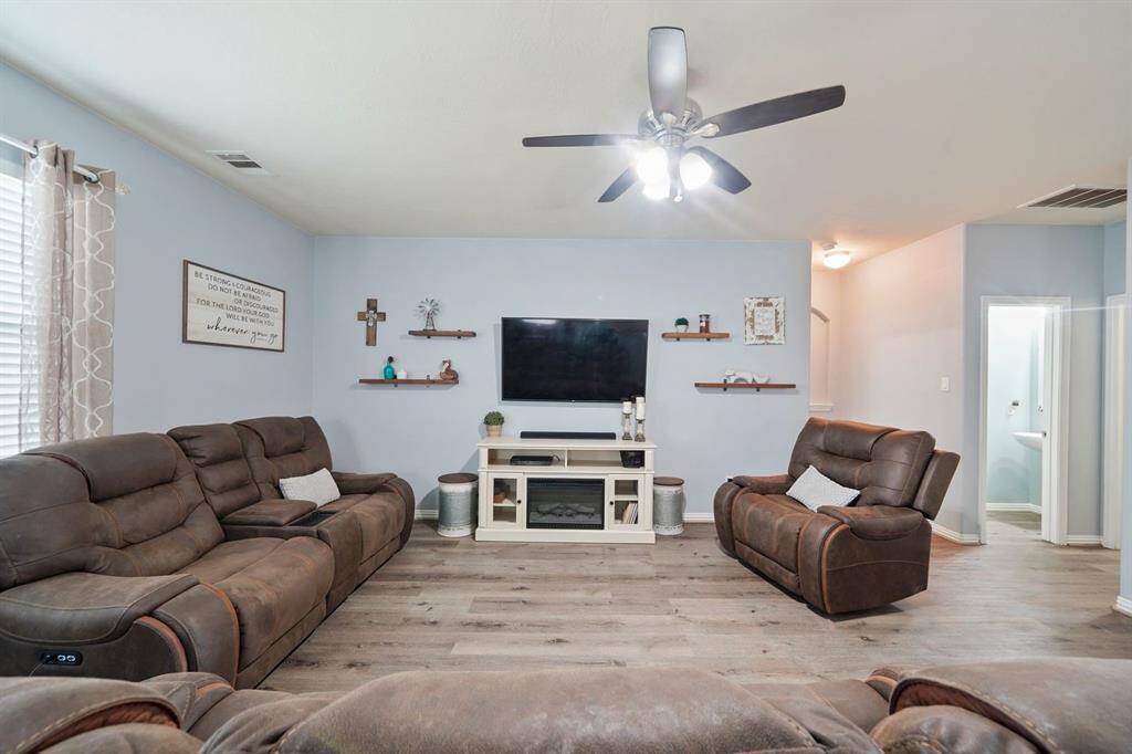 The family room allows plenty of space for you to create a cozy and inviting atmosphere.