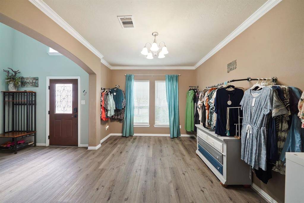The formal dining room can be used for entertaining family and friends.  Presently, the owner is using this room for a home boutique.