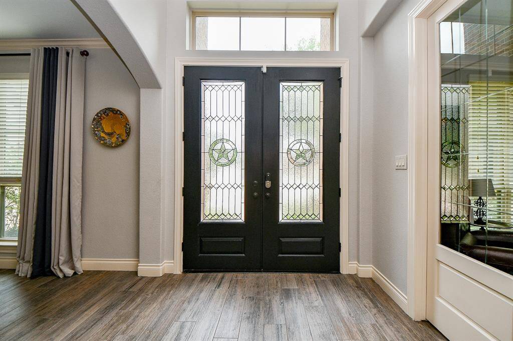 Simple elegance defines each particular feature in this special home, as pictured here in the front double door entry, from the inside, for starters. Inside this 2-story treasure are 5 bedrooms, 4-1/2 baths, all gracing a 13,181 square-foot-lot with 4,208 square-feet of interior space.