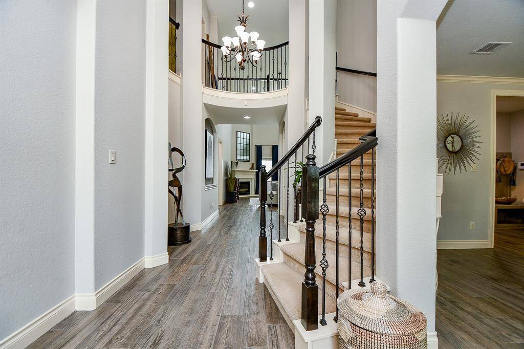 This plan offers a unique rotunda with spiral staircase and view from front entry to the back of the 1st floor and living area.