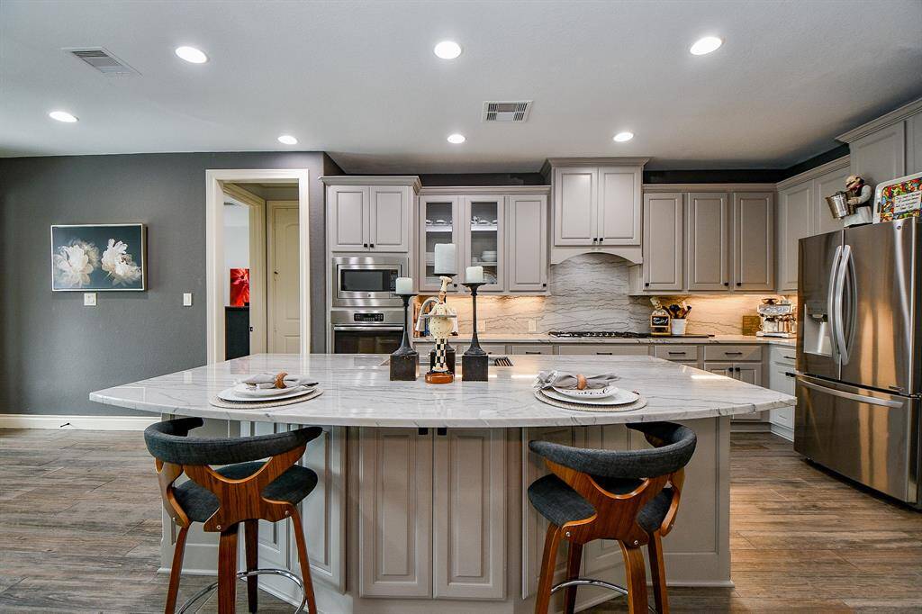 This view gives a full, realistic picture of the amazing size of the center island and extended counter top!