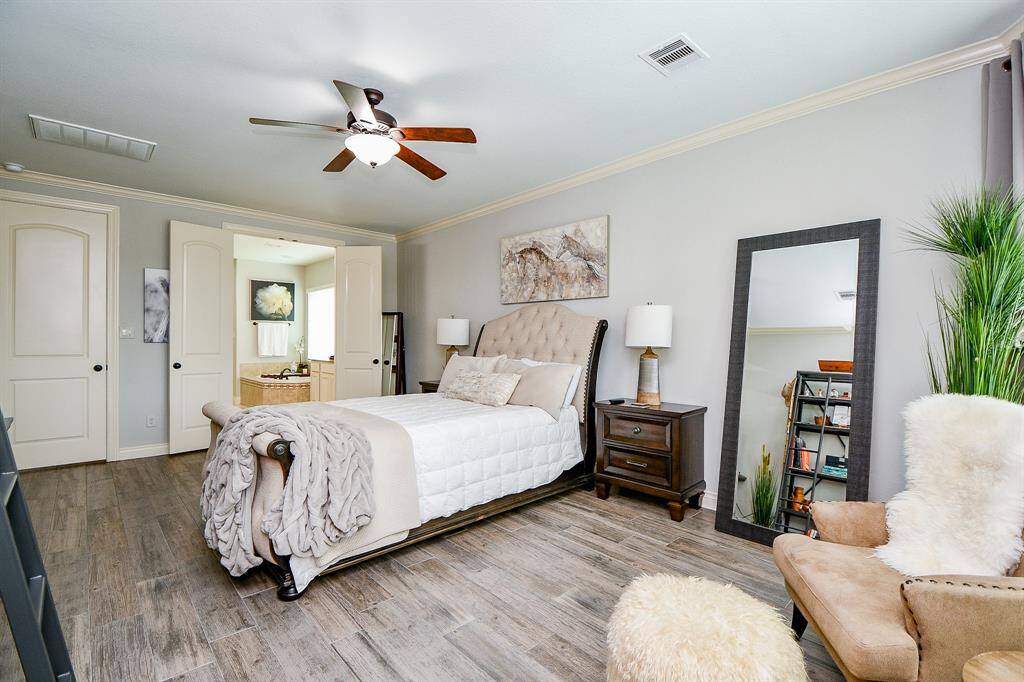 Your primary ensuite bathroom is beyond the double open doors, up center in this view.