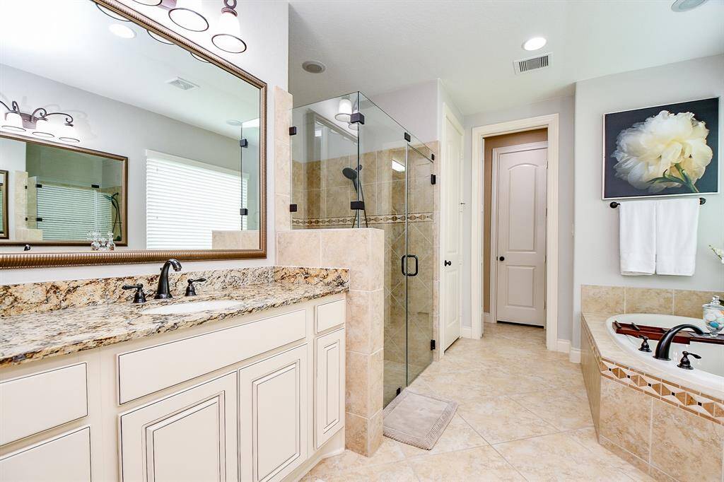 There's plenty of foot space in this lush primary ensuite bath.