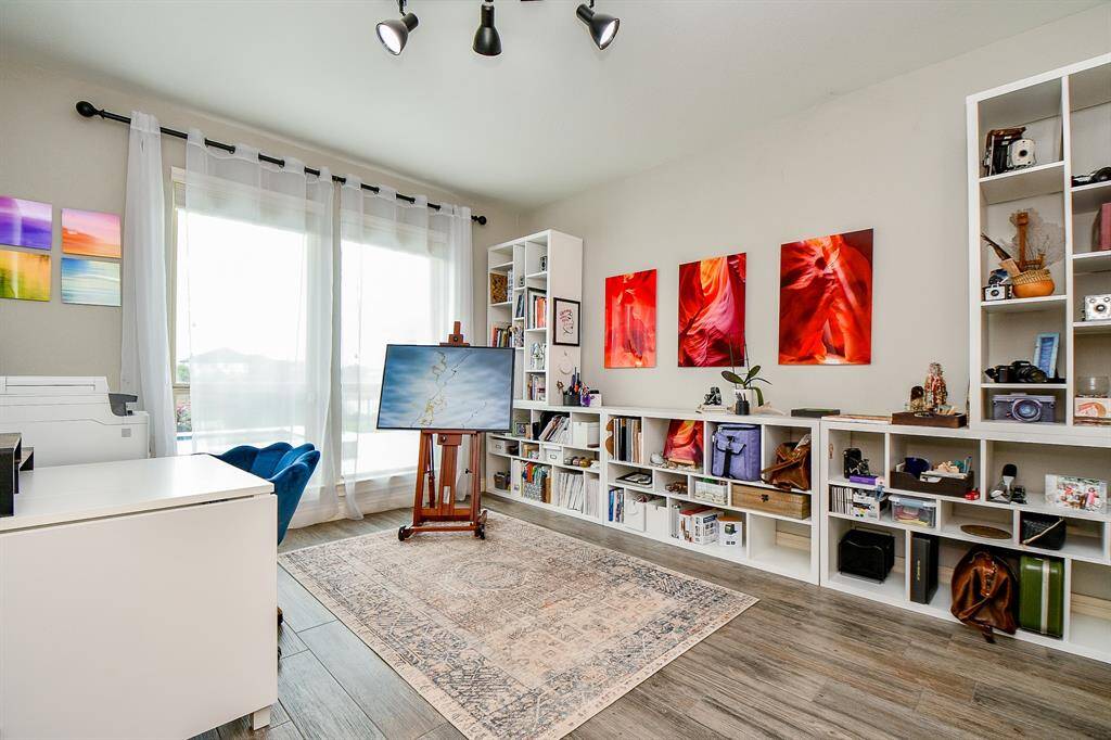 Large secondary bedroom downstairs has view of the backyard. Ensuite bathroom and large closet.