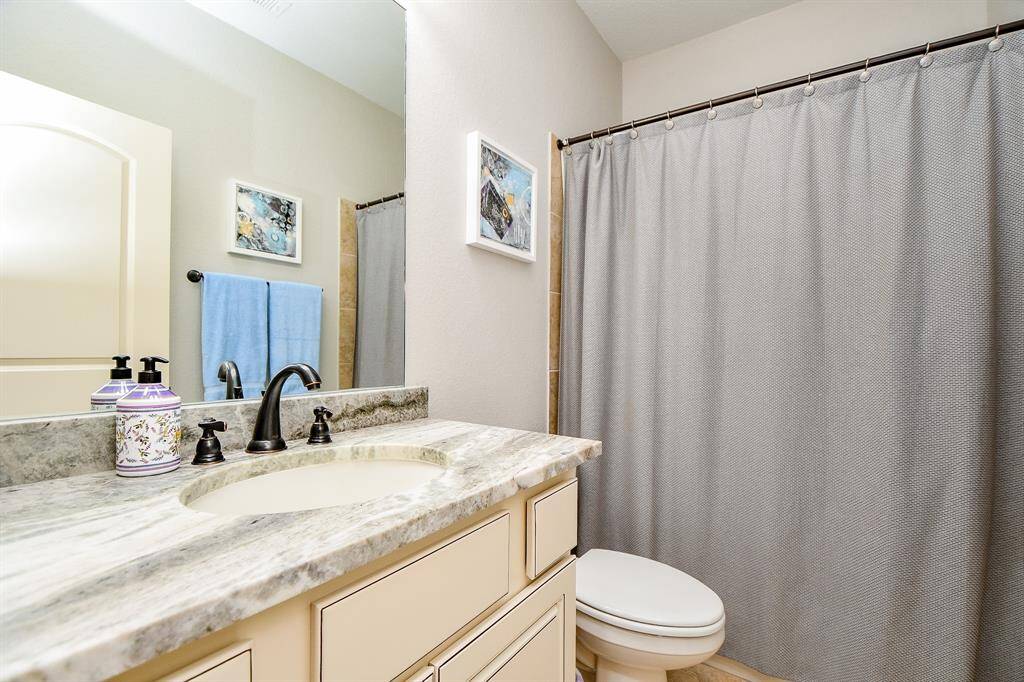 Another relaxing full bath offers combined shower/bathtub for easy options. Finished out with Quartzite counters.