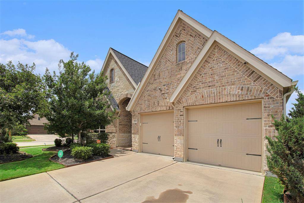 Double wide driveway and two car garage