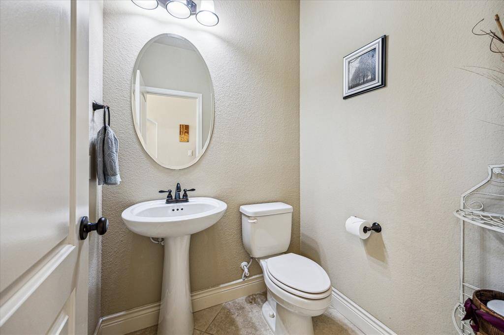 Half bath located between the study and formal dining room.