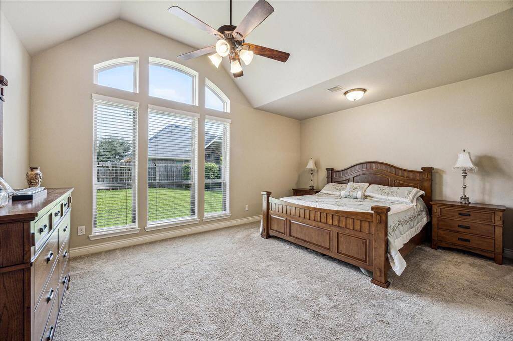 Primary suite features a wall of windows offering plenty of natural light!
