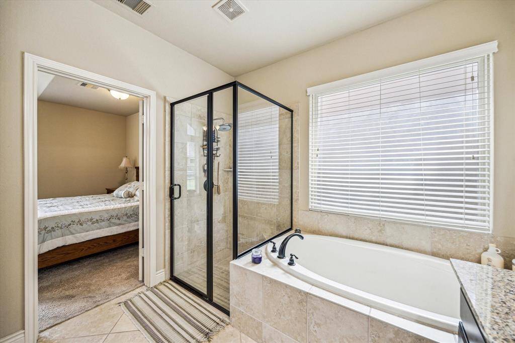 Primary ensuite with soaker tub and separate shower.