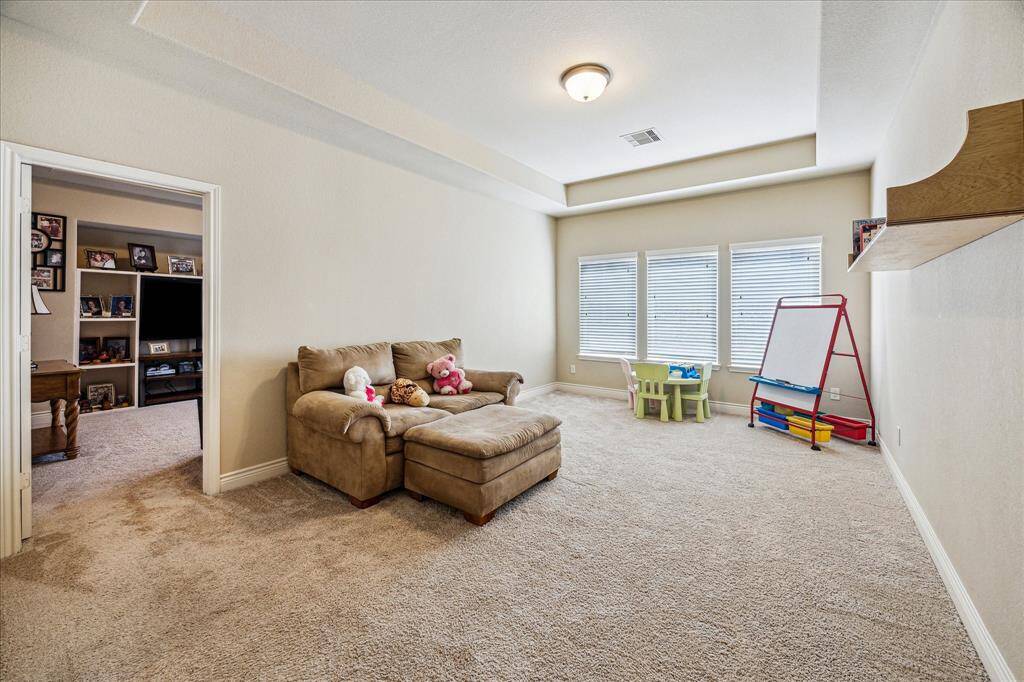 Spacious game room located at the top of the stairs