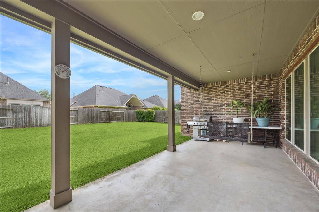 Enjoy relaxing on this Texas sized covered patio!