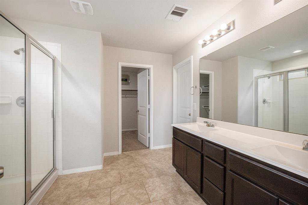 Spacious Primary bath with double sinks and a walk in shower!