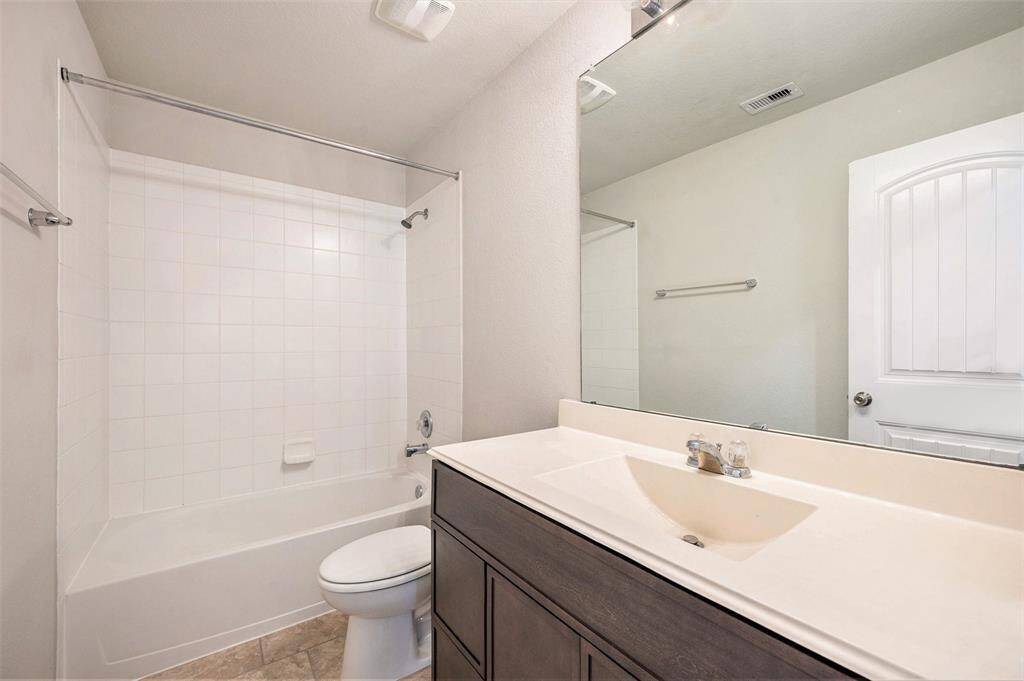 Secondary bathroom spacious enough for guests or children.