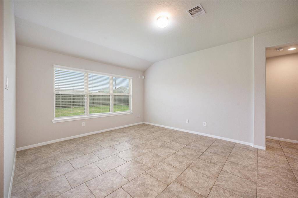 Family room has great natural light and nice tile floors