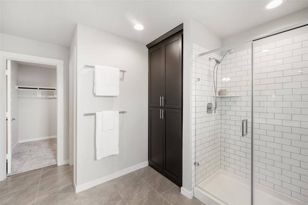 The door at left in  this well-planned space leads to the large walk-in closet!