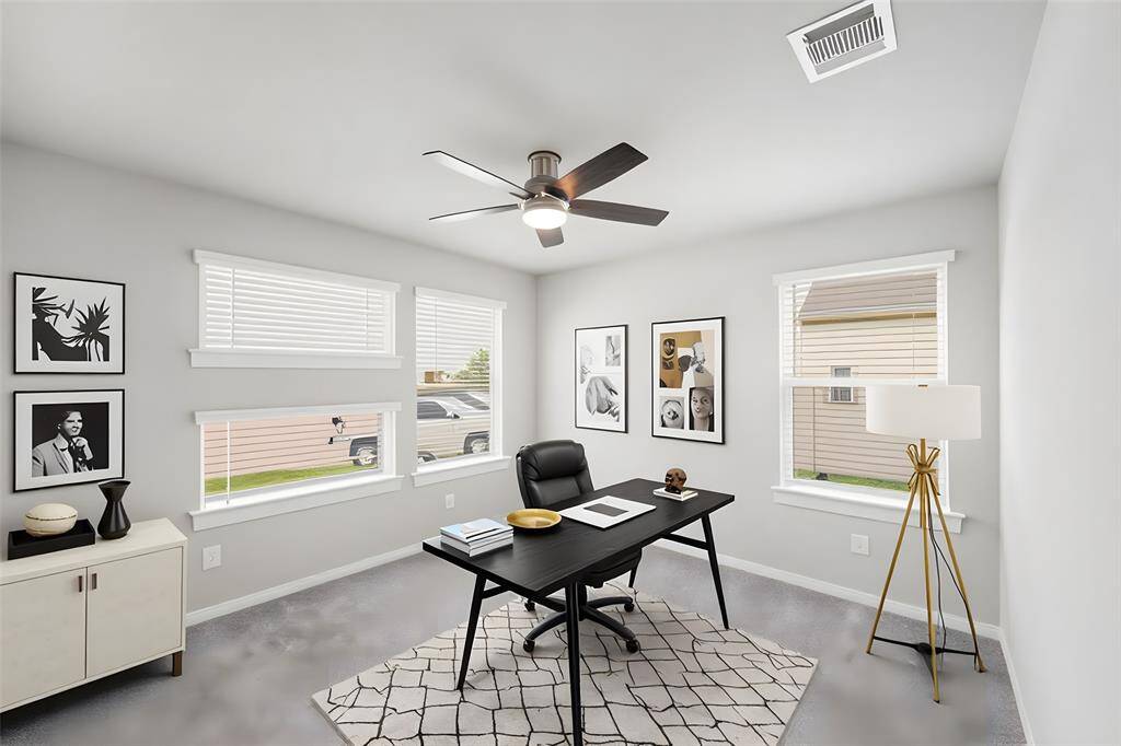 Bedroom 1 of 4 is on the front of the house and is virtually staged here as an office.  The room is light and bright, thanks to its four large windows!