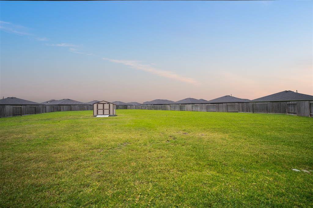 In the backyard is the highest-quality Tuff Shed with various upgrades, and HOA approval!
