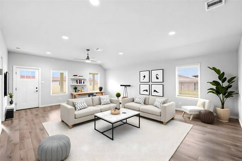 Here, the open and spacious family room is virtually staged to show the room's potential.