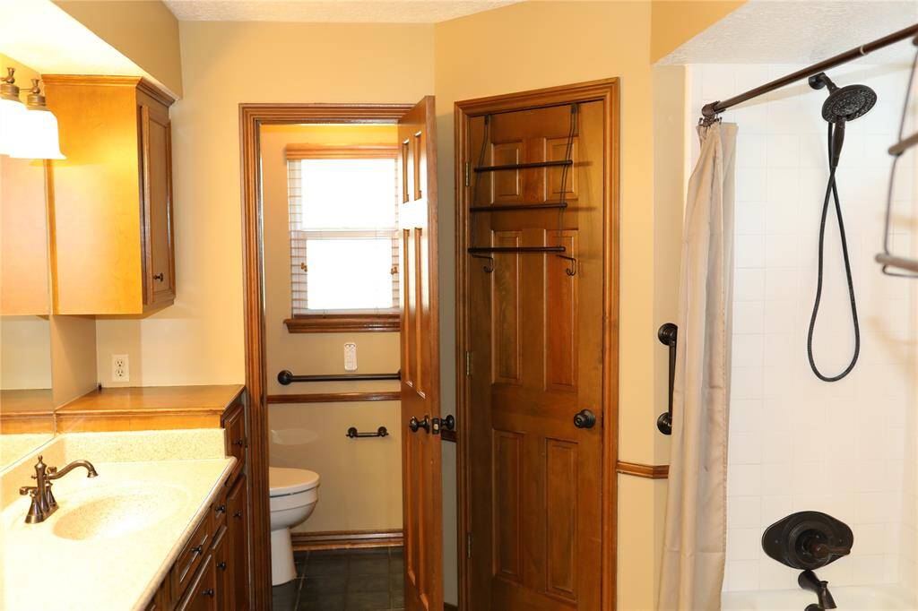 Primary bath with double closets and toilet room