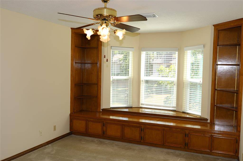 Bedroom 2 with window seat and built in cabinets