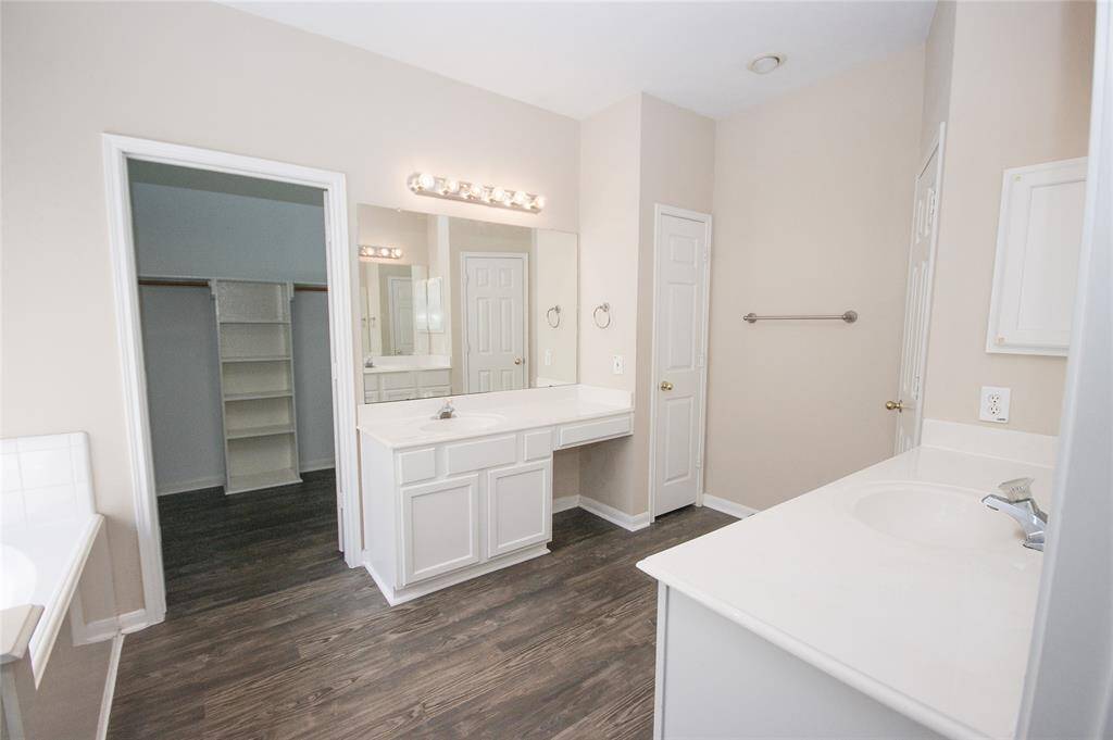PRIMARY BATH HAS DOUBLE SINKS AND HUGE VANITIES