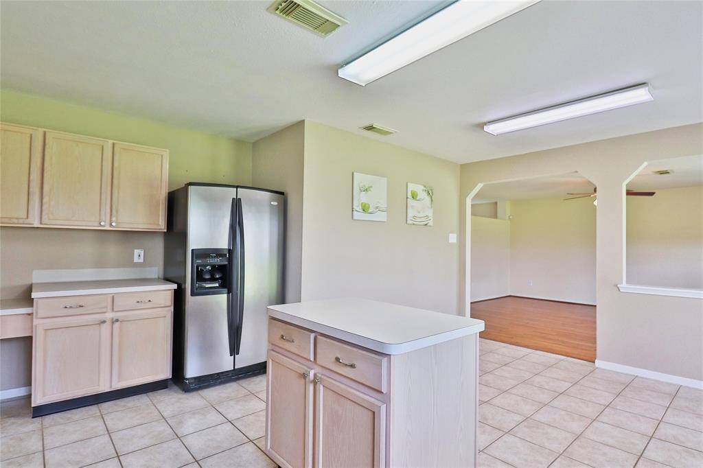 Kitchen opens to a spacious  family room.