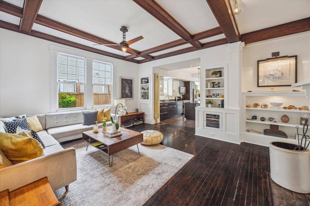 The downstairs powder room is tucked away in the foyer, convenient to both the living and dining areas.