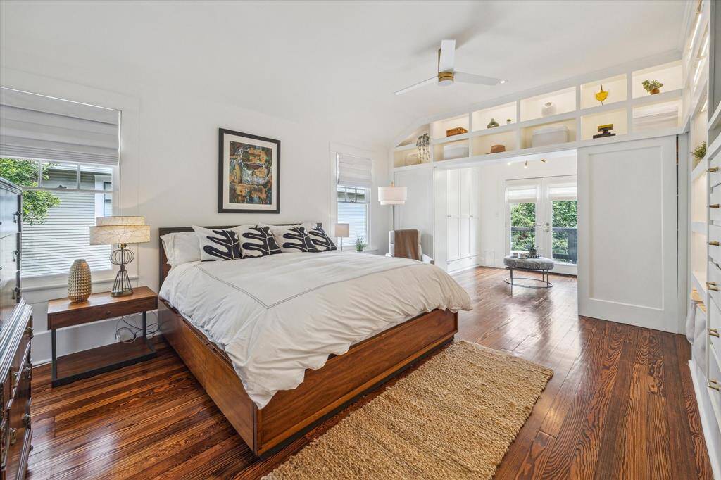 The dressing area is flanked with closets and leads out to the second floor deck.