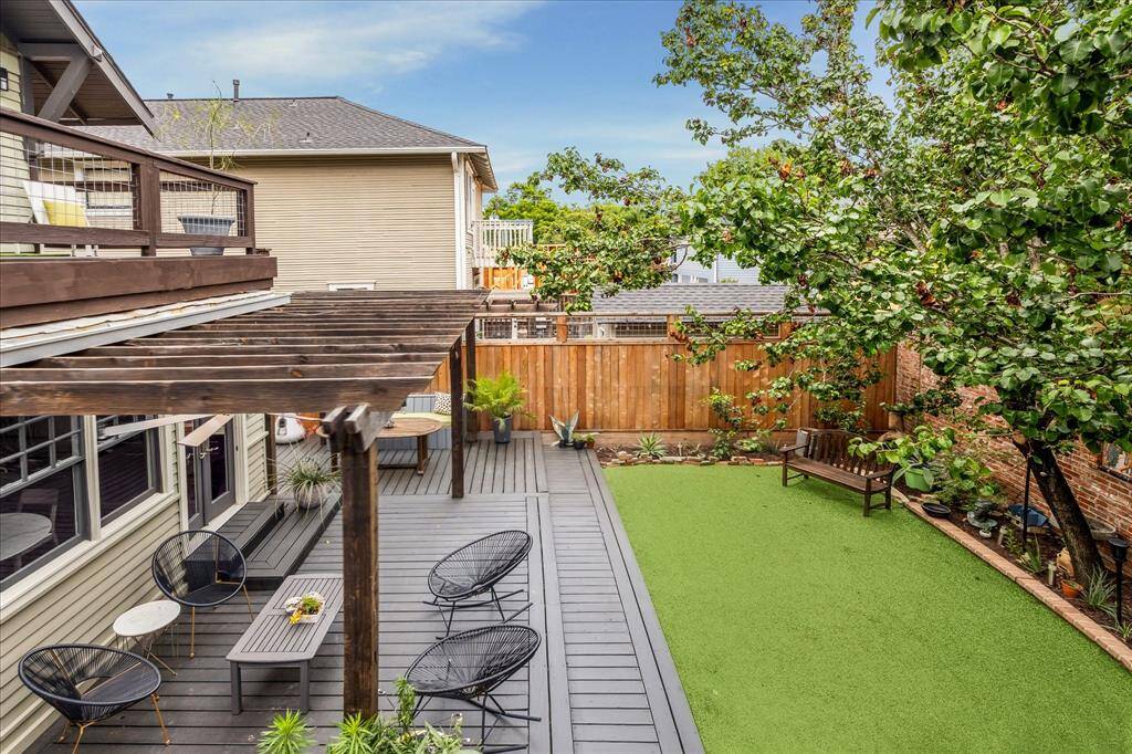 The back yard has extensive deck areas as well as green space.
