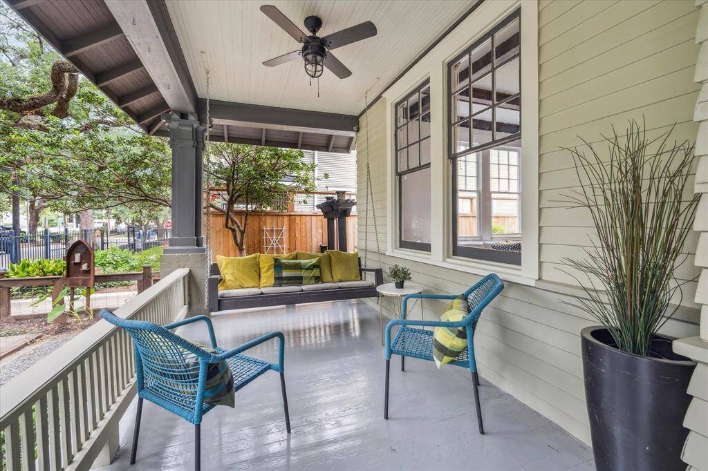 This William Wilson home is resplendent with historical details such as this original paneling, craftsman balusters and box ceiling.