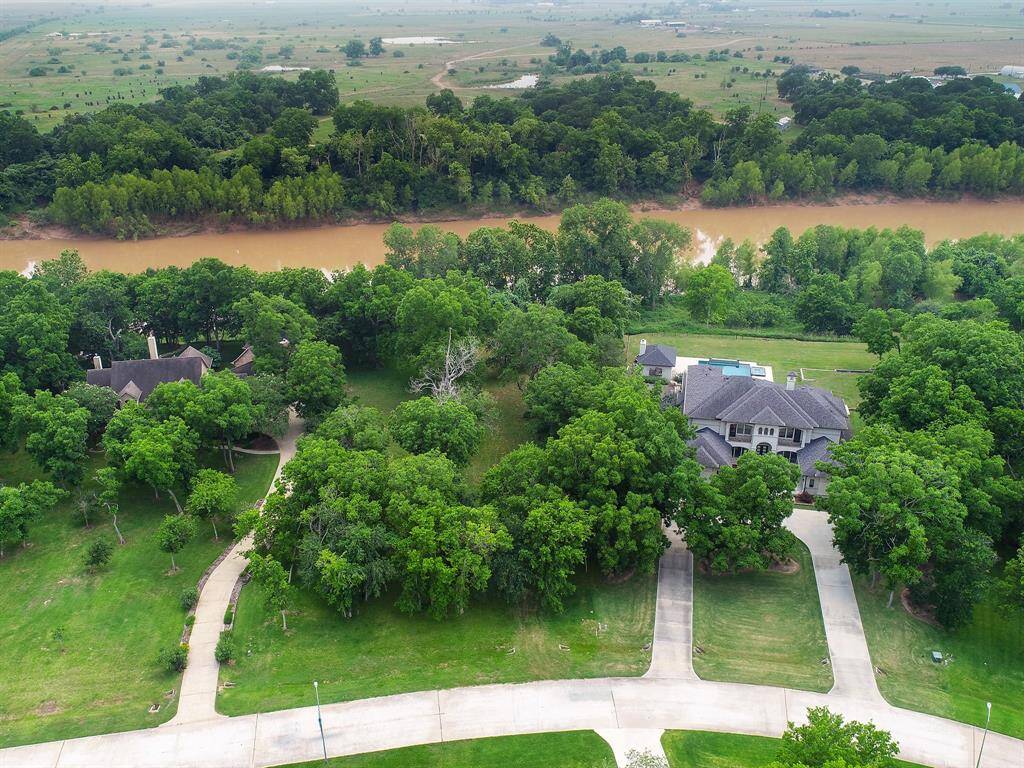 Gorgeous 1.73 Acre Lot in Riverwood Forest located on the Brazos River and outside the floodplain.