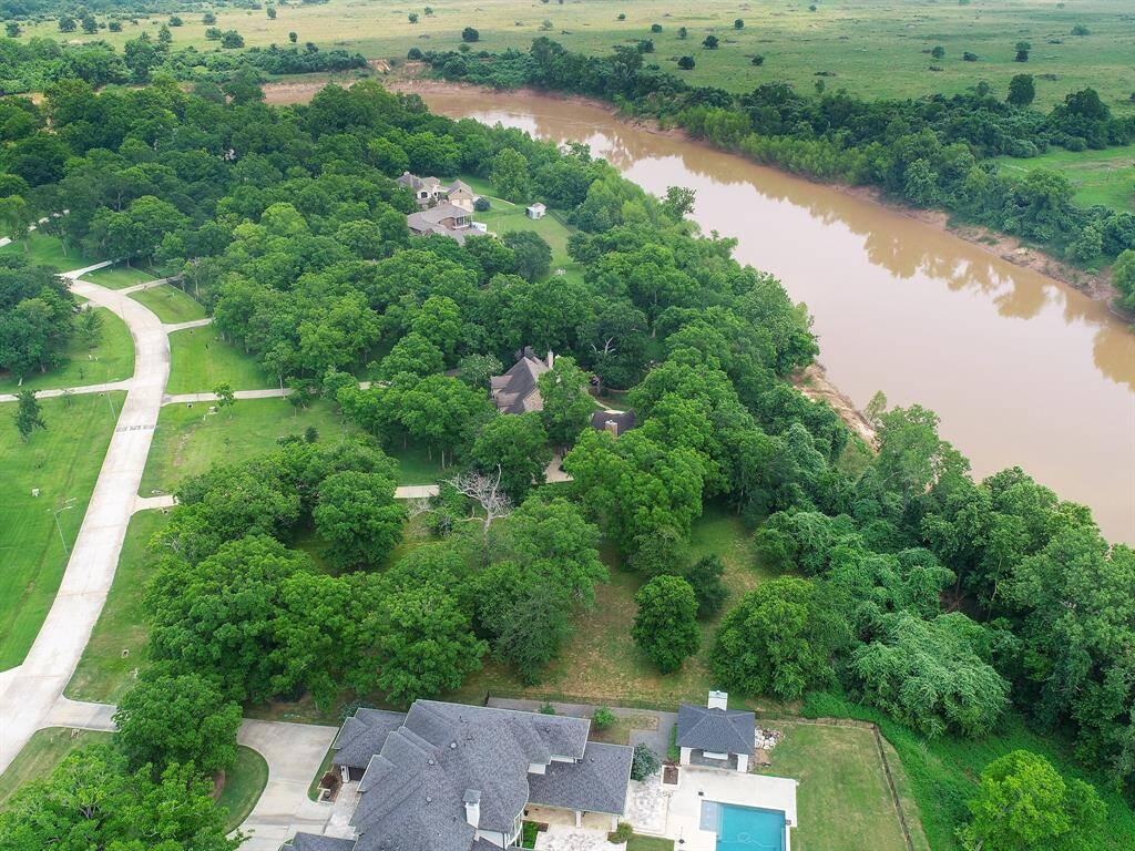 This view looking West shows how the river meanders through behind the property.