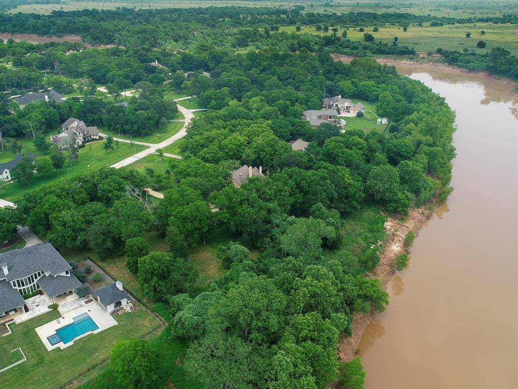 This aerial view from the back of the property shows all the privacy this Lot has to offer.