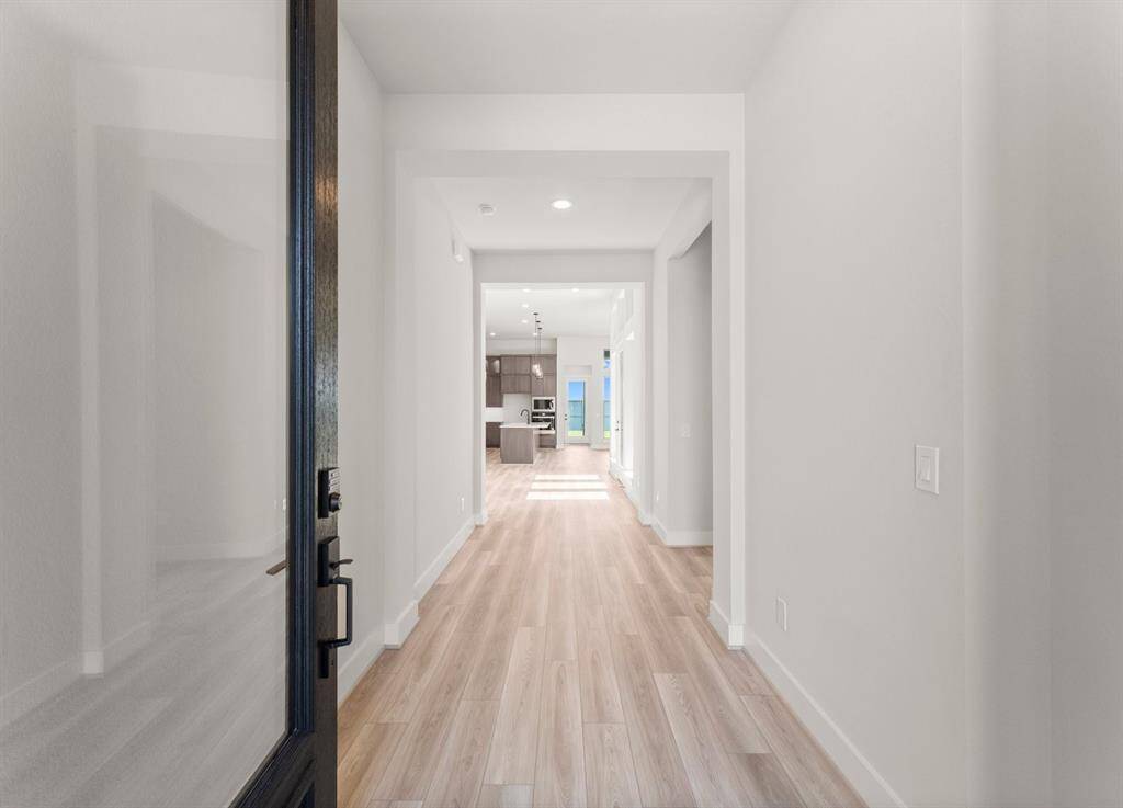 Open the Entry Door to Reveal Luxury Vinyl Plank Flooring