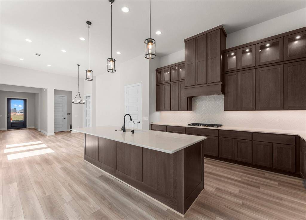 Space for Stools at the Island, Pendant Lighting, and Under Cabinet Lighting