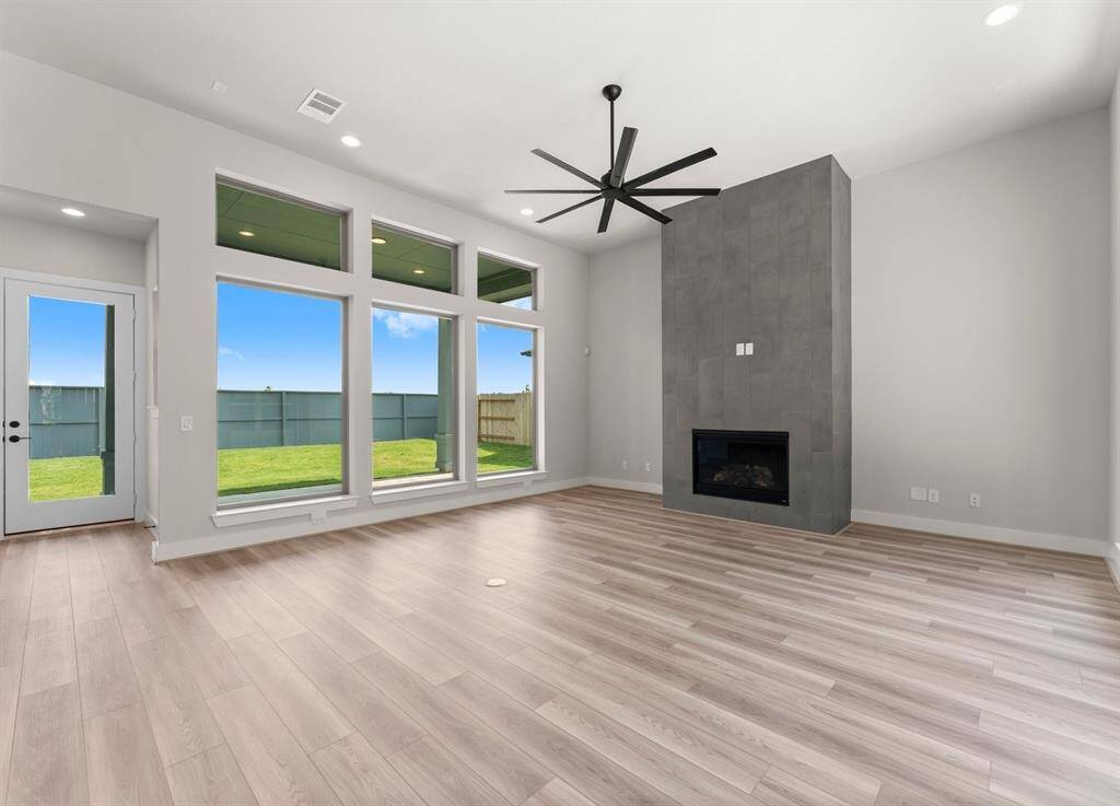 Gas Fireplace, Modern Fan, and LVP Flooring