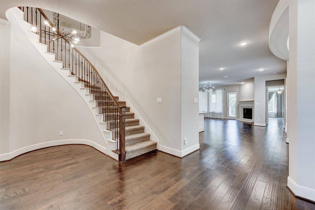 Beautiful spiral staircase leading upstairs.