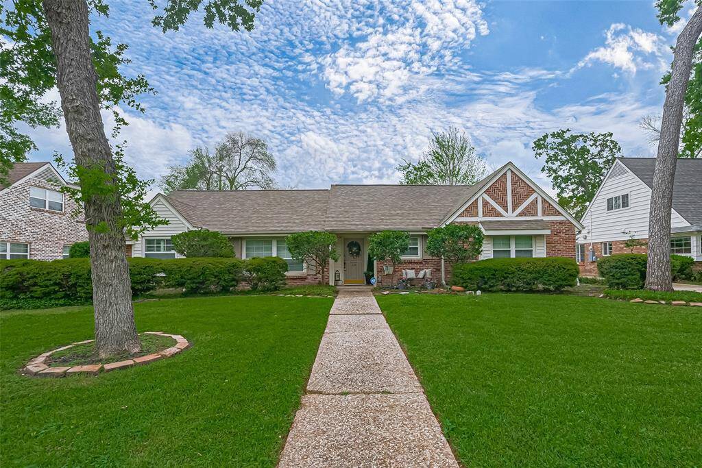 Welcome to 330 N Wilcrest in the coveted Wilchester Neighborhood. Charming single-story home with a welcoming front path, lush green lawn, and mature trees. The exterior features a mix of brick and siding, with decorative gable accents. Ideal for those seeking a cozy suburban setting.
