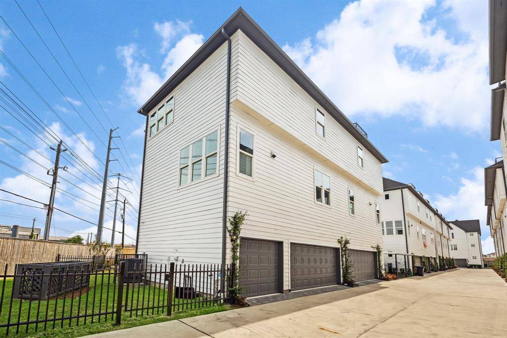 3 car garage, corner unit with large yard and spacious back driveway for easy access in and out of garage. private corner unit