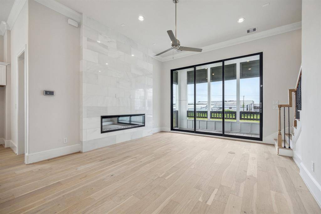 stunning wow factor floor to ceiling white marble fireplace and unobstructed views from balcony