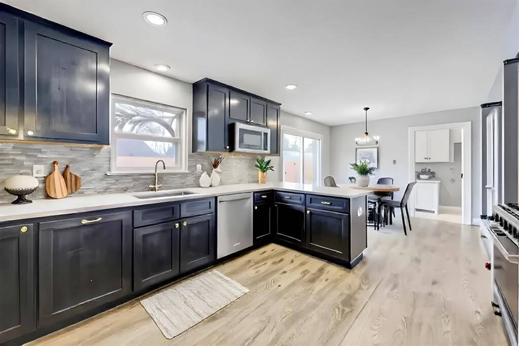 Fabulous gourmet kitchen, pretty marble backsplash, gorgeous quartzite counter tops, high end stainless steel appliances, custom shaker style cabinets. Stainless steel refrigerator on the left not shown.