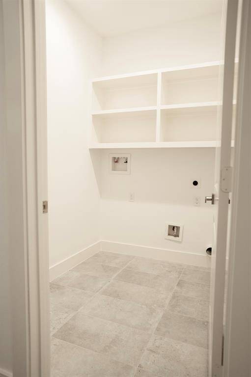 Utility room inside your home with custom shelving.