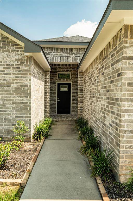 Long private entry with great landscaping.