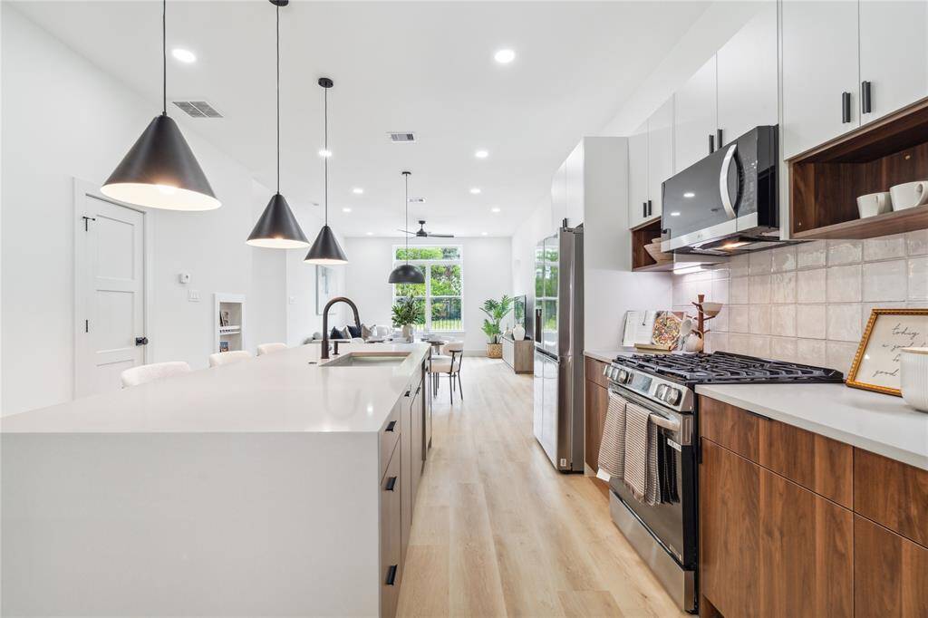 Form meets function with generous counter space, clean-lined cabinetry, and an inviting flow that makes everyday cooking feel inspired.