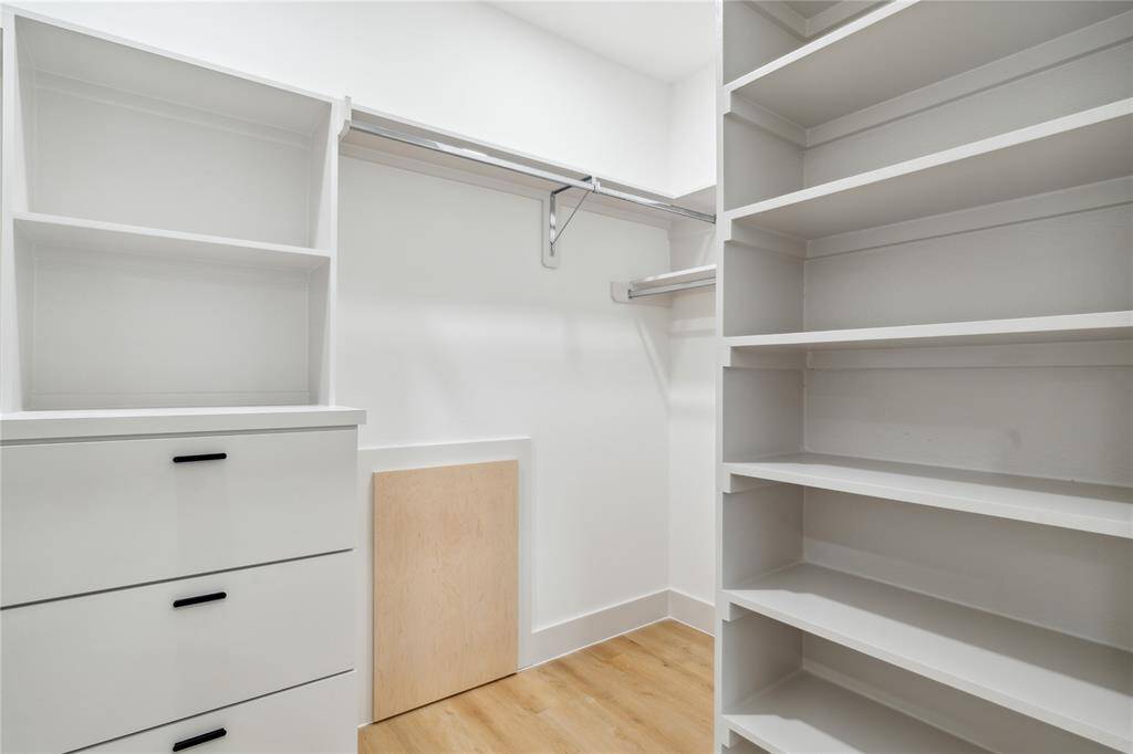 Your walk-in closet is more than just spacious—it’s smart. Custom shelving, drawers, and hanging rods are all thoughtfully designed to streamline your routine and maximize organization.