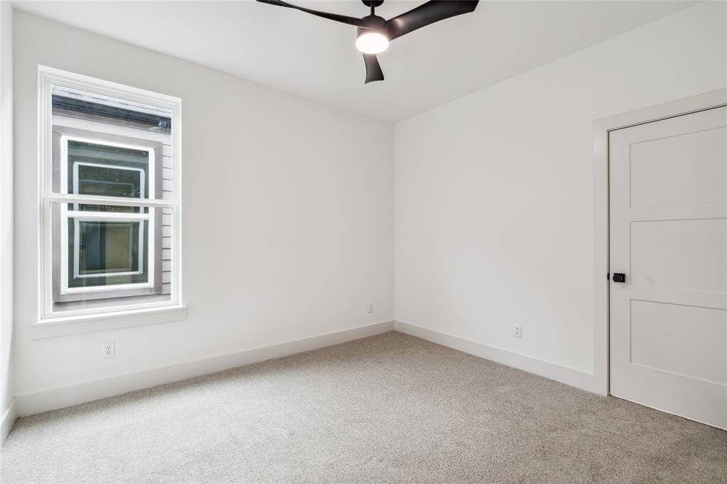 This third bedroom is light-filled and flexible—perfect as a guest room, nursery, or additional workspace.