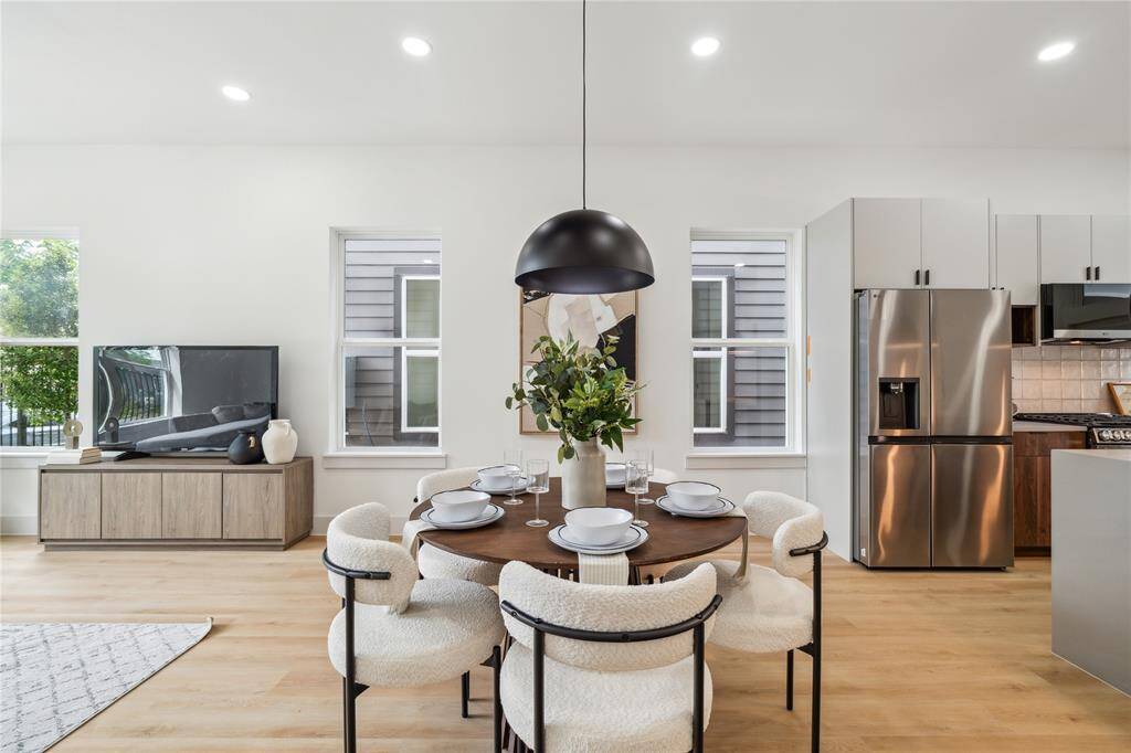 Warm LVP flooring and soft, neutral cabinetry create a calming backdrop for connection—perfect for everyday living or welcoming guests.