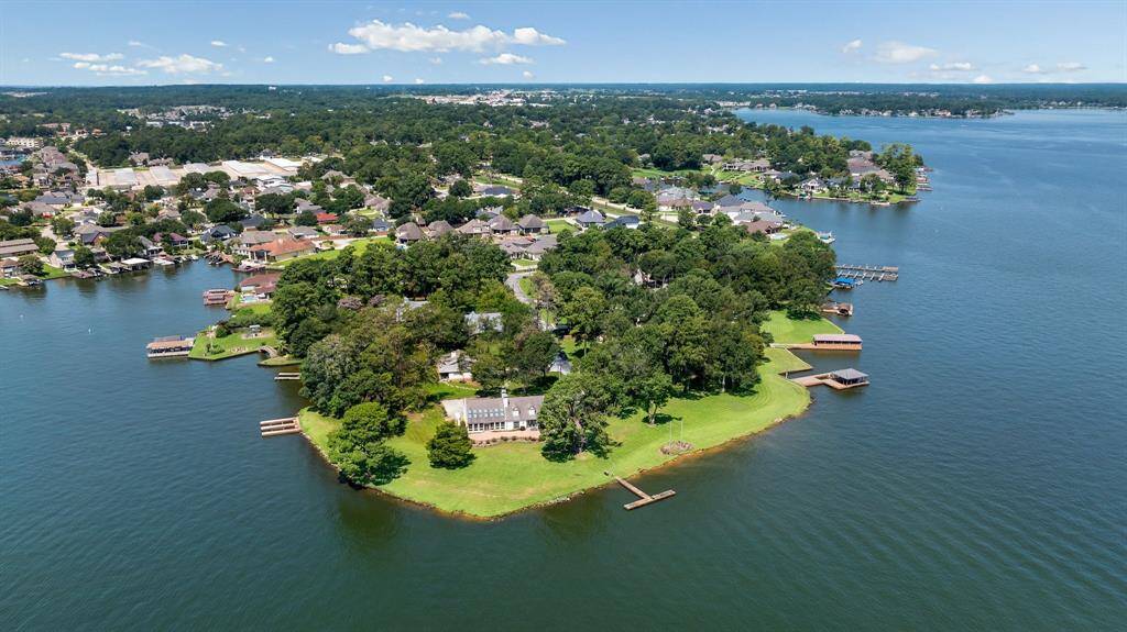 This entire point is being sold as one property made up of 3 sizeable lots creating approx 1300 Linear Feet of prime waterfront wrapping around the point from boat dock to boat dock!