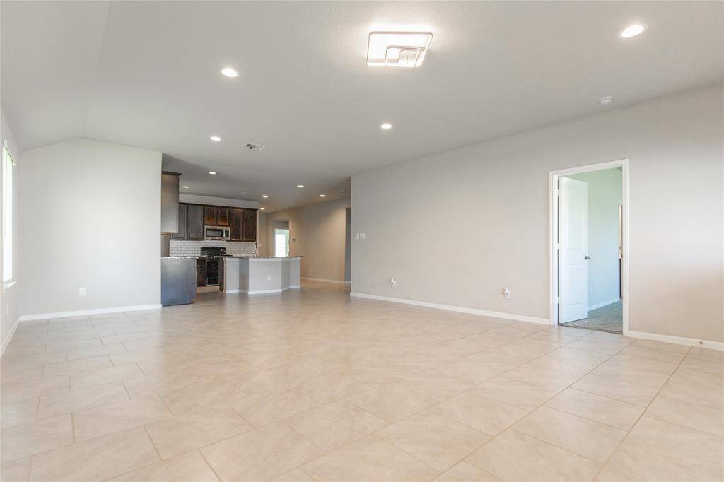 Another view to show the living area, dining and kitchen space.