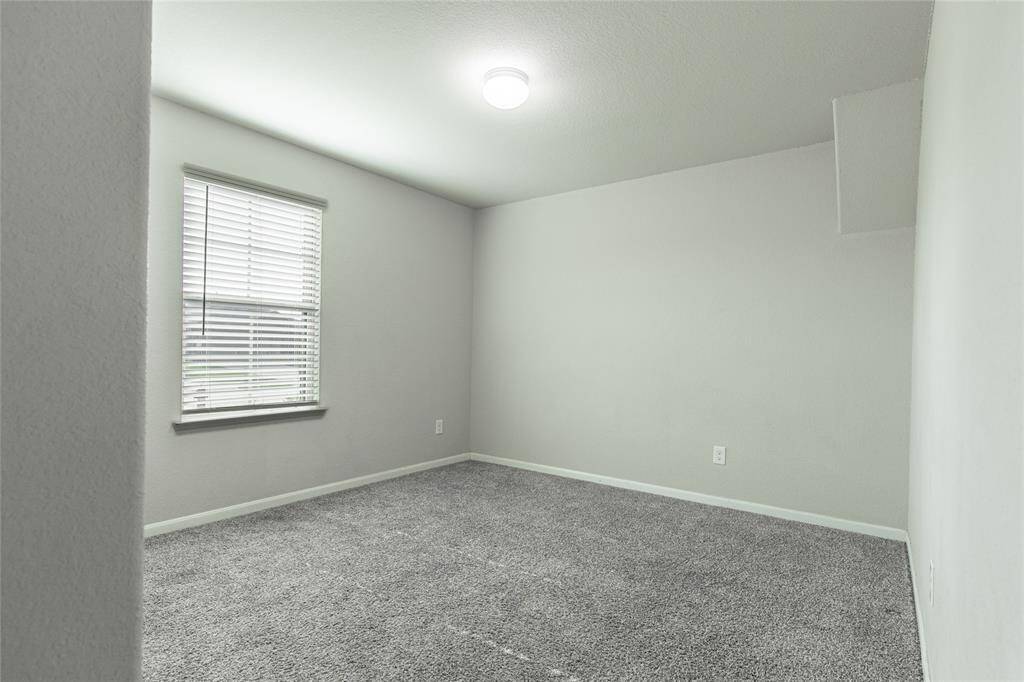 Bedroom 2, immediately to your left as you enter the front door.
